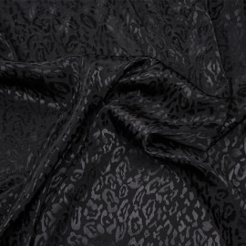 Tissu jacquard noir sergé à motif léopard satiné - pretty mercerie - mercerie en ligne