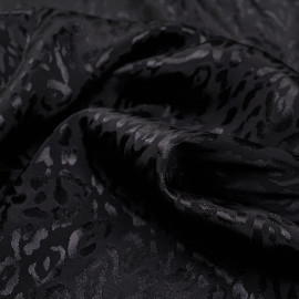 Tissu jacquard noir sergé à motif léopard satiné - pretty mercerie - mercerie en ligne