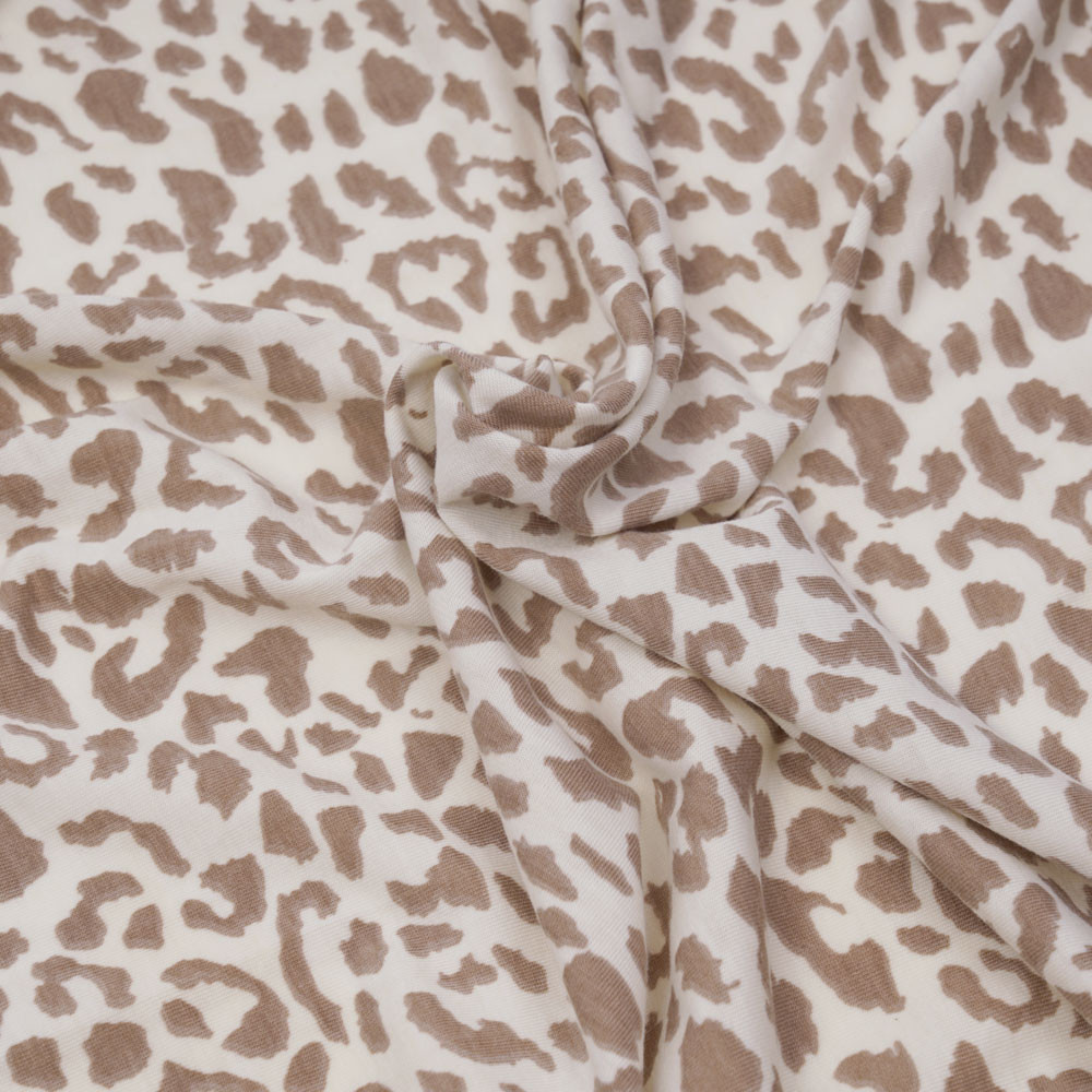 Tissu jersey chocolat blanc à motifs léopard beige - pretty mercerie - mercerie en ligne