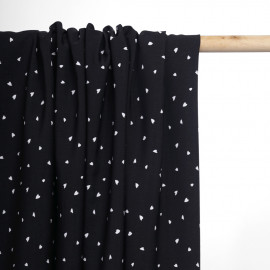 Tissu crêpe noir à motif petit coeur blanc | Pretty Mercerie | mercerie en ligne