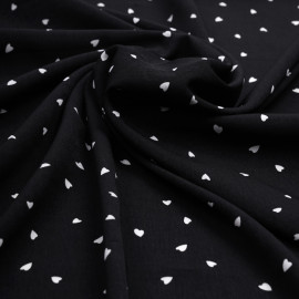 Tissu crêpe noir à motif petit coeur blanc | Pretty Mercerie | mercerie en ligne