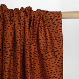 Tissu coton burnt orange à motif pois irrégulier et délavé noir| Pretty Mercerie | Mercerie en ligne