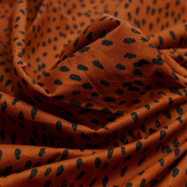 Tissu coton burnt orange à motif pois irrégulier et délavé noir| Pretty Mercerie | Mercerie en ligne
