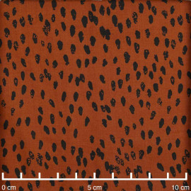 Tissu coton burnt orange à motif pois irrégulier et délavé noir| Pretty Mercerie | Mercerie en ligne